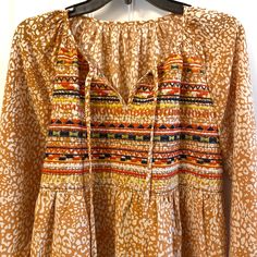 Fashionable Long-Sleeved Boho Flowing Blouse Orange And White With Embroidery Pattern On The Front Colorful Peasant Style 70’s Vibes Condition Is Brand New Never Worn 100% Polyester Women’s Medium Fits True To Size Brown Vintage Print Top For Spring, Cotton Peasant Top For Fall Vacation, Cotton Peasant Top For Vacation In Fall, Fall Cotton Peasant Top For Vacation, Spring Vacation Tops With Vintage Print, Spring Vacation Top With Vintage Print, Spring Vacation Vintage Print Tops, Long Sleeve Printed Peasant Top For Vacation, Hippie Patterned Tops For Fall