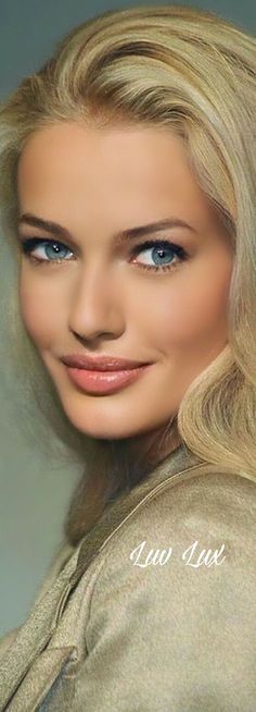 a woman with blonde hair and blue eyes is posing for a magazine cover photo shoot