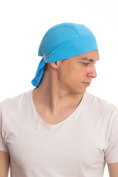 a man with a blue bandana on his head