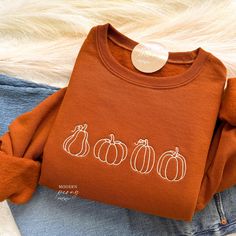 Fall Sweatshirt Embroidered, Pumpkin Patch Pumpkin Crewneck Sweatshirt Pumpkin Shirt, Pumpkin Sweater, Autumn Shirt Thanksgiving Sweatshirt ---HOW TO ORDER---   FOR EACH SHIRT CHOOSE: **Shirt type, size and color ---UNISEX SIZING--   Please see size chart in the pictures ---PRODUCT DETAILS--- Gildan Crewneck UNISEX Sweatshirt 50% cotton, 50% polyester Pre-shrunk Air jet yarn for softer feel and reduced pilling Double-needle stitched collar, shoulders, armholes, cuffs, and hem Gildan Crewneck UNI Casual Crew Top With Machine Embroidery, White Embroidered Logo T-shirt For Fall, Casual Sweatshirt With Machine Embroidery And Relaxed Fit, Casual Relaxed Fit Sweatshirt With Machine Embroidery, White Embroidered T-shirt For Fall, Fall Crew Neck Sweater With Custom Embroidery, Long Sleeve T-shirt With Embroidered Graphics For Fall, Cotton Sweatshirt With Machine Embroidery, Relaxed Fit, Cotton Sweatshirt With Machine Embroidery And Relaxed Fit