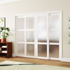 a living room filled with furniture and white walls