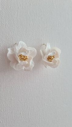 Elliane's floral earrings are made of lightweight yet durable white polymer clay. Each flower is carefully hand-sculpted and the centres are finished with Japanese Toho golden, silver or white beads, suspended on gold-filled or sterling silver hook earrings. Beautiful lightweight design and is easy to wear. Perfect for your garden-inspired wedding. Sent beautifully packaged in a Medze Bride gift box. As Élliane earrings are made to order especially for you as well due to hygienic reasons I canno Delicate White Handmade Flower Earrings, Delicate White Jewelry With 3d Flowers, Delicate White Flower Earrings With 3d Flowers, Delicate White Earrings With 3d Flowers, Gold Jewelry With 3d Flowers In Polymer Clay, Gold Polymer Clay Jewelry With 3d Flowers, White Flower Earrings With Ear Wire For Anniversary, White Flower Earrings For Anniversary With Ear Wire, Elegant White Flower Earrings In Polymer Clay