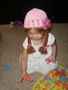 This is my short braid pigtails on an adorable crochet hat. It comes with a cute flower tulle clip with a rhinestone in the middle.   Braids will be 10-12 inches long. If you want a different length, just put the measurement in the notes to seller. Thanks.   Last picture shows the yarn color choices.  Message me with any questions or if you want to see a hat color with a yarn color :).   PLEASE SPECIFY WHAT COLOR RIBBONS AND TULLE CLIP YOU WOULD LIKE IN THE NOTES TO SELLER. IF YOU DON'T, I WILL Braid Pigtails, Short Braid, Autumn Hat, Flower Tulle, Crochet Wig, Wig Hat, Pigtail Braids, Short Braids, Frozen Inspired