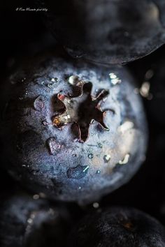 some blueberries with water droplets on them