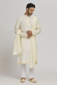 Cream kurta with thread embroidered floral patterns and sequin work embellishments. Comes with churidar and dupatta. - Aza Fashions Festive Chanderi Sherwani With Dupatta, Unstitched Chanderi Sherwani With Dabka Work, Festive Chanderi Sherwani With Dabka Work, Unstitched Dola Silk Sherwani With Resham Embroidery, Festive Chanderi Semi-stitched Sherwani, Festive Semi-stitched Chanderi Sherwani, Semi-stitched Chanderi Sherwani With Zari Work, Traditional Chanderi Sherwani With Dabka Work, Traditional Dabka Work Chanderi Sherwani