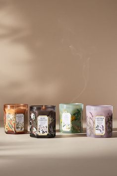 Adorned with beautiful botanicals, this *only-at-Anthro* fragrance lends everyday elegance to any living space - *and* is perfectly giftable for the scent-obsessed. Sol Tobac (Floral Gourmand): An enticing aroma of sun-kissed bergamot and a soft hint of white flowers gently dances atop a warm base of tobacco and vanilla. *For the best burn experience, keep the following in mind:* * The first time you light your candle, allow it to burn until the wax pool melts all the way to the edge; for a larg Candle Set Packaging, Scented Candles Packaging, Luxury Candles Packaging, Iridescent Candle, Candle Glass Jar, Candle Luxury, Candle Designs, Apothecary Candles, Good Burns