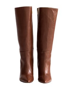 A Bestseller! The Celina Boot by Alma Caso is the quintessential tall boot. Featuring soft brown leather, a pointy toe, chunky heel and interior zipper, you'll want to get this boot in every color! 4 millimeter padding for a bit more comfort. Comes with dust bag. Runs small. Order one full size up. DETAILS 100% LeatherHandmade in MexicoTops measure 13.5 inches3.5 inch heel Cognac Calf Leather Heeled Boots For Work, Brown Calf Leather Knee-high Boots With Almond Toe, Chic Calf Leather Wedge Boots With Pointed Toe, Chic Pointed Toe Calf Leather Wedge Boots, Chic Cognac Heeled Boots For Work, Brown Leather Pointed Toe Wedge Boots, Brown Snip Toe Boots For Office, Brown Knee-high Calf Leather Heeled Boots, Brown Pointed Toe Heeled Boots For Work