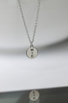 Initial necklace for men - chain necklace with a silver tone disc pendant with the engraving of your choice. Personalized necklace for men - engrave any word, letter or symbol. This necklace would make a great custom gift for birthday, anniversary or any occasion. Please write your engraving request at the 'Personalization' section before checkout.  Clasp closure.  Chain material: stainless steel (waterproof) Charms material: stainless steel (waterproof) Chain thickness: 2mm Pendant size: 1.5 cm Personalized Silver Round Disc Charm Necklace, Silver Minimalist Hand Stamped Necklace, Hand Stamped Round Pendant Necklace For Best Friend, Silver Charm Necklace For Personalized Gift, Silver Round Disc Charm Necklace For Personalized Gift, Silver Round Disc Charm Necklace As Gift, Silver Medallion Necklace For Anniversary Gift, Engraved Silver Charm Necklace For Anniversary, Engraved Silver Charm Necklace Anniversary Gift