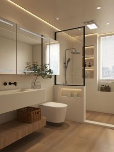 a modern bathroom with wood flooring and white walls