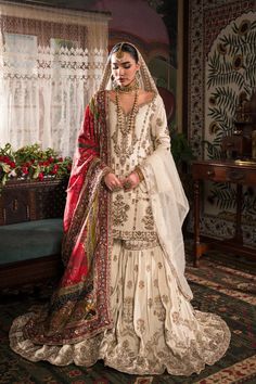 Ivory Gold Embroidered Pakistani Bridal Dress Classic Kameez Gharara is simply elegant, covered in motifs inspired by old Mughal imagery with delicate floral motifs and rich borders decorating the entire ghera. Bridal Gharara Designs, Gold Pakistani Bridal Dress, Gold Gharara, Gharara Designs Pakistani Bridal, Red Gharara, Bridal Gharara, Bridal Sharara, Bride Era, Gharara Designs