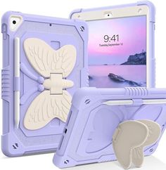 an ipad case with a butterfly design on the front and back, sitting next to it's holder