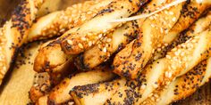 sesame seed breadsticks on a cutting board