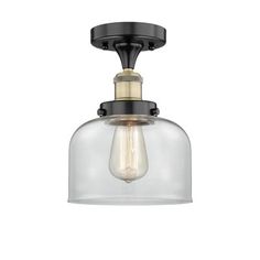 a light fixture with a clear glass shade