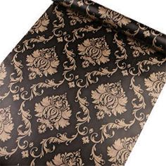 a black and gold tie with an intricate design on it