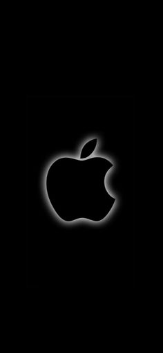 an apple logo is shown in the dark