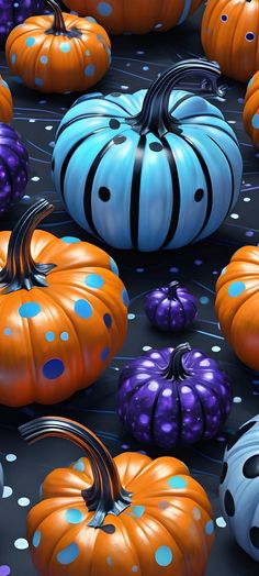 many pumpkins and polka dots are arranged on a black surface with blue, orange, and purple spots