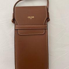 Brand New Celine Pouch In Lambskin Leather/Calfskin Lining -Crossbody For Sunglasses Or Iphone (My Iphone 11 Pro Max Fits Perfectly Inside) -Comes With Celine Black Cloth For Cleaning Sunglasses 100% Authentic- Does Not Comes With Duster Size:10x19x2cm Luxury Brown Pouch Phone Bag, Luxury Brown Rectangular Phone Bag, Modern Brown Phone Bag With Detachable Strap, Luxury Brown Phone Bag With Cell Phone Pocket, Modern Brown Crossbody Phone Bag, Luxury Brown Shoulder Bag With Card Slots, Luxury Brown Phone Bag For Daily Use, Elegant Brown Phone Bag With Card Slots, Chic Brown Phone Bag With Cell Phone Pocket