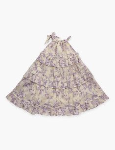 The Halliday Swing Dress in Yellow/Lilac Floral from our Summer Swim 2024 Collection. A cotton printed kids dress featuring an elasticated neckline. Cotton Dress With Gathered Neckline For Garden Party, Lavender Cotton Dress For Garden Party, Lavender Dresses For Daywear, Cotton Daywear Dress With Gathered Neckline, Cotton Daywear Dress In Purple, Lavender Cotton Dress With Floral Print, Lavender Cotton Daywear Dress, Printed Cotton Purple Dresses, Lavender Cotton Dress With Ruffles