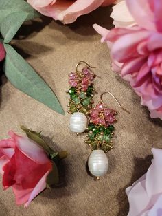 Pink and Green Crystal & Natural Pearl Earrings Beautiful Pink and Green Crystals adorn a natural pearl! A must have for tea parties, brunch, spring, summer and Easter wear! This is also perfect gift for the Sorors of Alpha Kappa Alpha Sorority!!! Pink Green and Pearls! You cant go wrong!!! These earrings are light weight and are great for casual to formal wear. Ships within 1 to 3 days A CT Original Design Stock Item Pink And Green Earrings, Elegant Beaded Spring Earrings, Summer Party Pearl Drop Earrings, Elegant Pearl Charm Earrings For Summer, Summer Party Drop Pearl Earrings, Elegant Summer Pearl Earrings With Pearl Charm, Elegant Pearl Earrings With Pearl Charm For Summer, Elegant Handmade Earrings For Spring, Elegant Handmade Spring Earrings