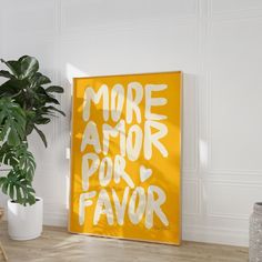 there is a yellow sign that says more amor por favor on it next to a potted plant