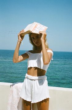 The perfect summer top has arrived! The Malibu Top is made from a ribbed cotton fabric in an off white hue. It features a ruffled hemline and tank sleeves that can be worn on of off shoulder! Complete the look with the Malibu Shorts, Raffia Backpack and Stripe Scrunchie! By Sabo Skirt. Does Your Mother Know, Beachy Aesthetic, Beachy Outfits, Summer Holiday Outfits, Sabo Skirt, Vacation Style, European Summer, Aesthetic Outfits, Summer Top