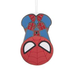 a spiderman ornament hanging from a string