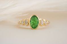 The Solstice Ring | 1.6 CT Oval Starbrite™ Tsavorite - Lavender Creek Gems Tsavorite Ring, John Dyer, Alexandrite Ring, Blue Tourmaline, Watermelon Tourmaline, Garnet Rings, Green Tourmaline, Emerald Diamond, Birthstone Ring