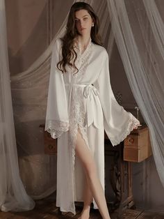 Summer Ice Silk Lace Robe
Main fabric: 95.3% polyester 4.7% spandex
Lace: 89.3% nylon 10.7% spandex




Robe Size/cm


Length


Bust


Sleeve


Shoulder


Fit weigh




M


131


103


46


38.5


40-55kg




L


132


107


47


39.5


55-60kg




XL


133


111


48


40.5


60-70kg







 	The above size is manually measured by “tiling-stretching”, there may be an error of 1-3cm!
 	The size is for reference only, please choose according to your size.
 	It is recommended to wash by hand in co Fitted V-neck Sleep Robe, Fitted V-neck Robe For Sleep, Elegant Stretch Sleepwear For Lounging, White Long-length Sleepwear For Loungewear, Fitted White V-neck Robe, Fitted Long Sleeve Sets For Night, Long Sleeve Lace Trim Sets For Wedding Night, Satin Open Front Loungewear Robe, Open Front Satin Robe For Loungewear