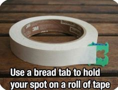 a roll of tape sitting on top of a wooden table