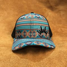 Front Color: Turquoise Navajo Bill Color: Turquoise Navajo Mesh Color: Black American Mesh Closure: Snapback Bill Shape: Curved Southwestern Blue Hats For Beach, Bohemian Turquoise Hat For Festivals, Southwestern Turquoise Hat For Ranch, Southwestern Style Turquoise Hat For Ranch, Navajo Print, Cowgirl Accessories, I'm Broke, Turquoise And Purple, Team Gear