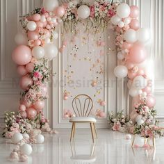 a white chair sitting in front of a pink and white balloon arch