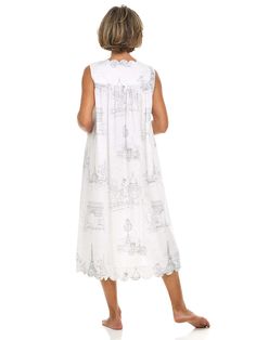 Forget pants and slip into the most enchanting nightgown. Made from soft, breathable cotton, this paris print nightgown’s loose fit offers you unrestricted movement, making it easy to put on and take off. The wide straps provide extra support (and no accidental peek-a-boos), while the flowing design and feminine details, such as a scalloped trim and mother-of-pearl buttons, add a romantic touch. Handcrafted by skilled artisans, this nightgown combines true artistry and quality with timeless styl Spring Sleeveless Nightgown For Overnight, Summer Nightgown With Relaxed Fit For Overnight, Relaxed Fit Nightgown For Summer Nights, Sleeveless Relaxed Fit Sleepwear For Bedtime, Summer Nightgown With Relaxed Fit, Relaxed Fit Nightgown For Summer, Summer Sleeveless Nightgown, White Printed Dresses For Loungewear, Spring Sleeveless Nightgown