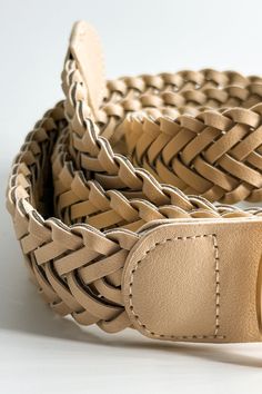 The Everly Braided Adjustable Belt, a symbol of timeless sophistication and artisanal craftsmanship. Meticulously designed with attention to detail, this belt exudes elegance and versatility, perfect for elevating any ensemble. Crafted from supple leather fabric, the Everly belt combines luxurious texture with enduring durability. The smooth surface of the leather adds a touch of refinement, while the braided details along the length of the belt enhance its visual appeal with intricate texture a Chic Leather Rope Belt, Adjustable Beige Rope Belt, Classic Leather Rope Belt, Classic Beige Leather Belt, Chic Adjustable Rope Belt, Beige Leather Belt With Removable Feature, Beige Leather Belt With Removable Buckle, Elegant Brown Belt For Everyday Use, Elegant Adjustable Beige Belt