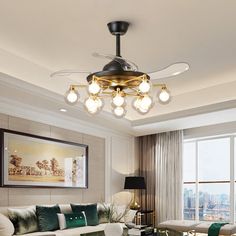 a living room filled with lots of furniture and a chandelier hanging from the ceiling