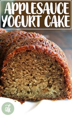 a close up of a cake on a plate with the words applesauce yogurt cake