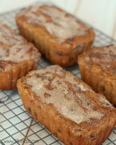 four muffins sitting on top of a cooling rack