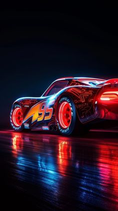 a car that is lit up in the dark with neon lights on it's side