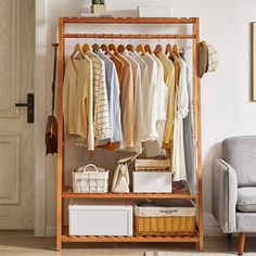 an open closet with clothes and baskets on it