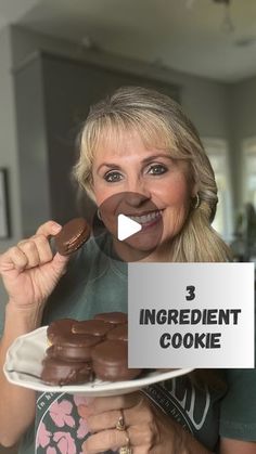 a woman holding a plate with chocolate cookies on it and the words 3 ingredient cookie