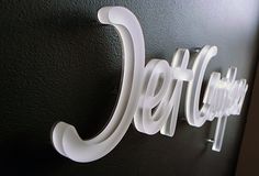 a close up of a sign on a wall with the word jellopop written below it