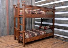 a wooden bunk bed sitting on top of a hard wood floor next to a wall