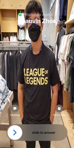 a man wearing a face mask in a clothing store