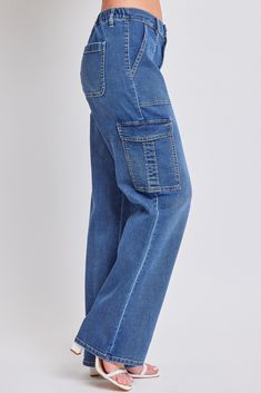 Discover our most comfortable denim cargo jeans for women! This stretchy, straight-leg jean features two classic front pockets, back patch pockets, and functional side cargo pockets. Detailed with an elastic waistband for maximum comfort, and a classic zip fly and button closure for an elevated look. The elastic waistband provides maximum comfort and a snatched waist creates the illusion of longer, leaner legs. Our cargo jeans for women feature a straight-leg fit from hip to hem and are full len Dark Wash Full Length Cargo Jeans With Multiple Pockets, Utility High Rise Flare Jeans With Side Pockets, Medium Wash Utility Jeans With Cargo Style, Medium Wash Cargo Style Utility Jeans, Dark Wash Cargo Jeans With Multiple Pockets, Medium Wash Utility Cargo Jeans, Utility Cargo Style Jeans In Medium Wash, Utility Cargo Jeans In Medium Wash, Relaxed Fit Dark Wash Full Length Cargo Pants