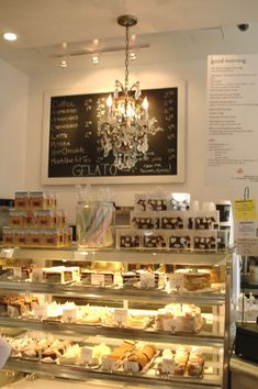 a display case in a bakery filled with pastries