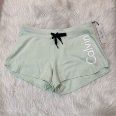 Light Mint Green Color Has A Drawstring No Liner Has Back Pocket Loose Fit Waistband Is Approximately 17.5 Inches Across When Laying Flat Inseam Is Approximately 3 Inches Originally $39 Ynf 451 (L) Calvin Klein Bottoms With Elastic Waistband, Calvin Klein Fitted Casual Shorts, Calvin Klein Cotton Shorts For Loungewear, Calvin Klein Bottoms For Spring Loungewear, Calvin Klein Stretch Bottoms For Beach, Calvin Klein Spring Shorts, Calvin Klein Fitted Shorts, Calvin Klein Summer Loungewear Shorts, Calvin Klein Loungewear Summer Shorts