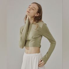 Nwt Long Sleeve Solid Fitted Crop Top (Eagle) - Nap Loungewear This Ultra Soft, Slim Fit, Crop Top Features A Wide Round Front Neckline With A Low Scoop/Open Back. It Also Has A Unique Elastic Band Around The Back To Secure The Top In Place. 'Eagle' Color Is A Pretty Neutral Olive/Muted Green Hue. Cute For Exercise Or Casual Wear! Size Small New With Tags 35.6% Viscose, 26.8% Acrylic, 26.8%Cotton, 10.8% Spandex Please See Actual Product Photos For Garment Color And Detail, Which May Vary Slightl Versatile Fitted Beige Top, Khaki Fitted Long Sleeve Top, Stretch Khaki Tops For Loungewear, Spring Khaki Tops For Loungewear, Fitted Khaki Tops For Fall, Fitted Khaki Tops With Crew Neck, Fitted Khaki Crew Neck Tops, Khaki Stretch Crew Neck Top, Fitted Khaki Spring Tops