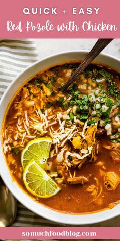 a white bowl filled with mexican soup and garnished with cilantro, limes, onions, shredded cheese, and tortilla