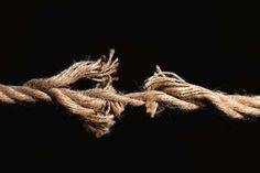 two pieces of rope that have been tied together on a black background with space for text