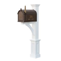 a mailbox mounted on the side of a white post with an open door and two letters