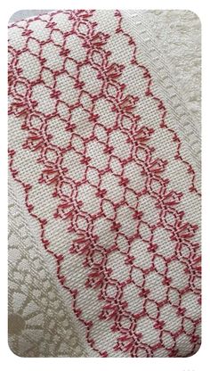 red and white lace on fabric